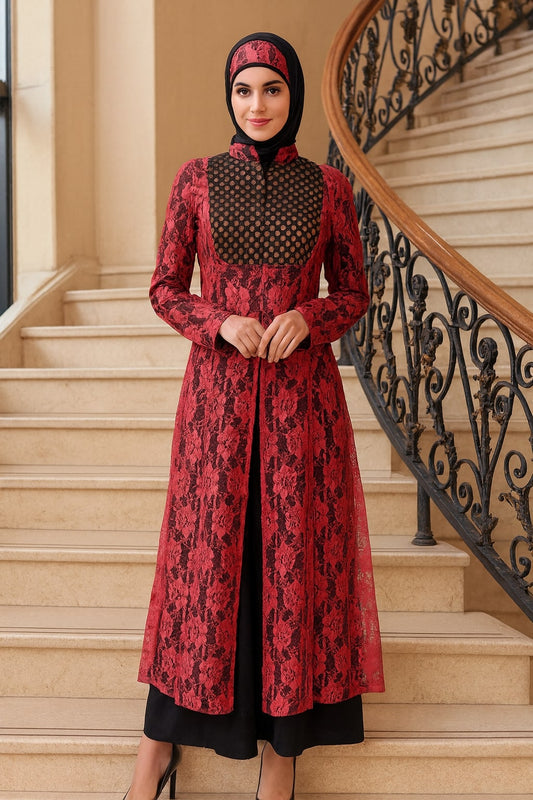 Woman in a red and black patterned dress standing on a staircase.