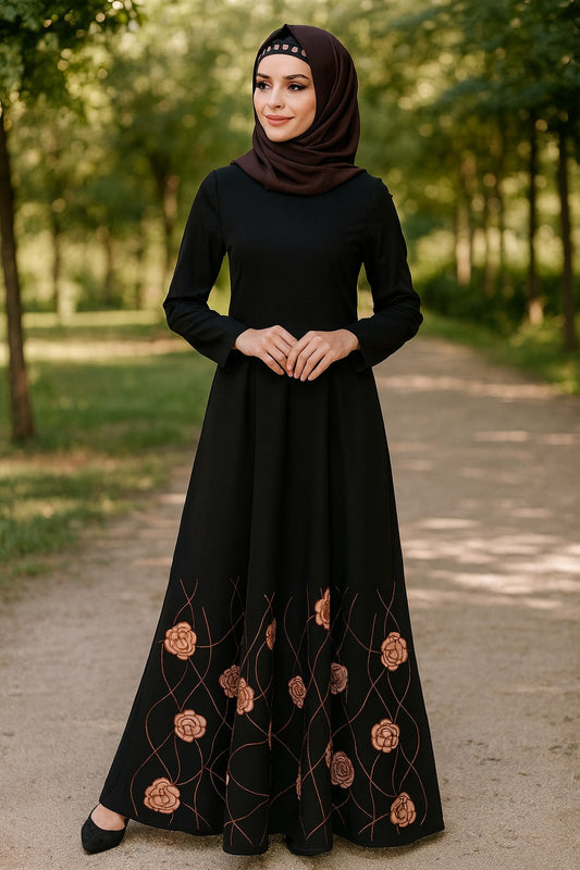 Woman wearing a black dress with floral embroidery in a park setting