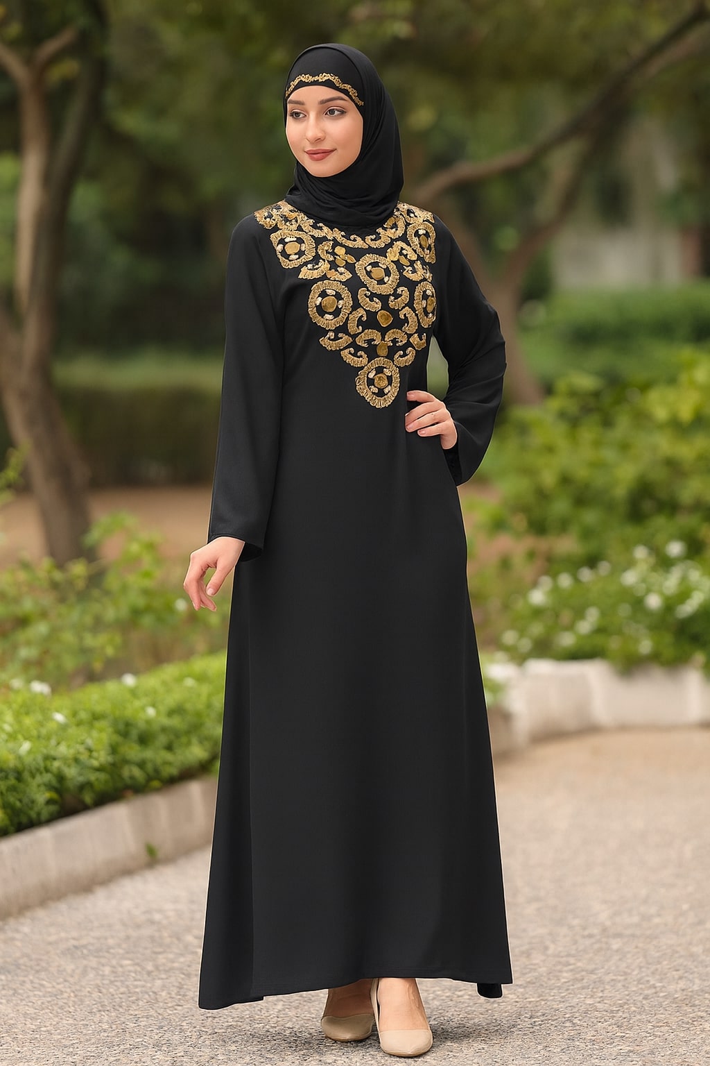 Woman wearing a black abaya with gold embroidery in an outdoor setting