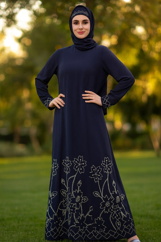 Woman wearing a dark blue dress with floral patterns in an outdoor setting