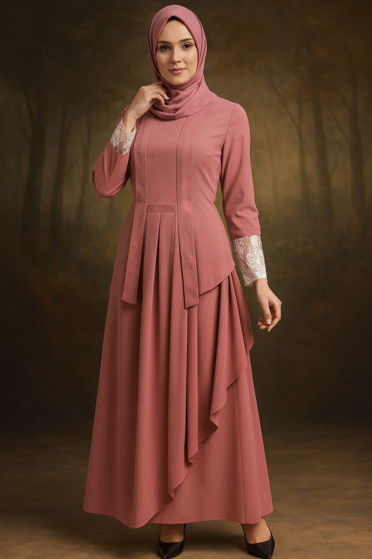 Woman wearing a pink dress with a hijab against a dark background