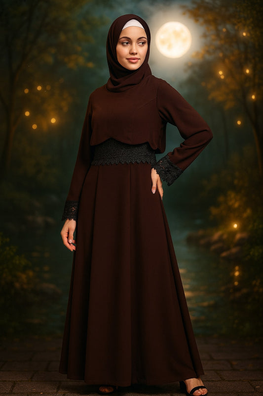 Woman in a long brown dress standing in a mystical forest with a full moon.