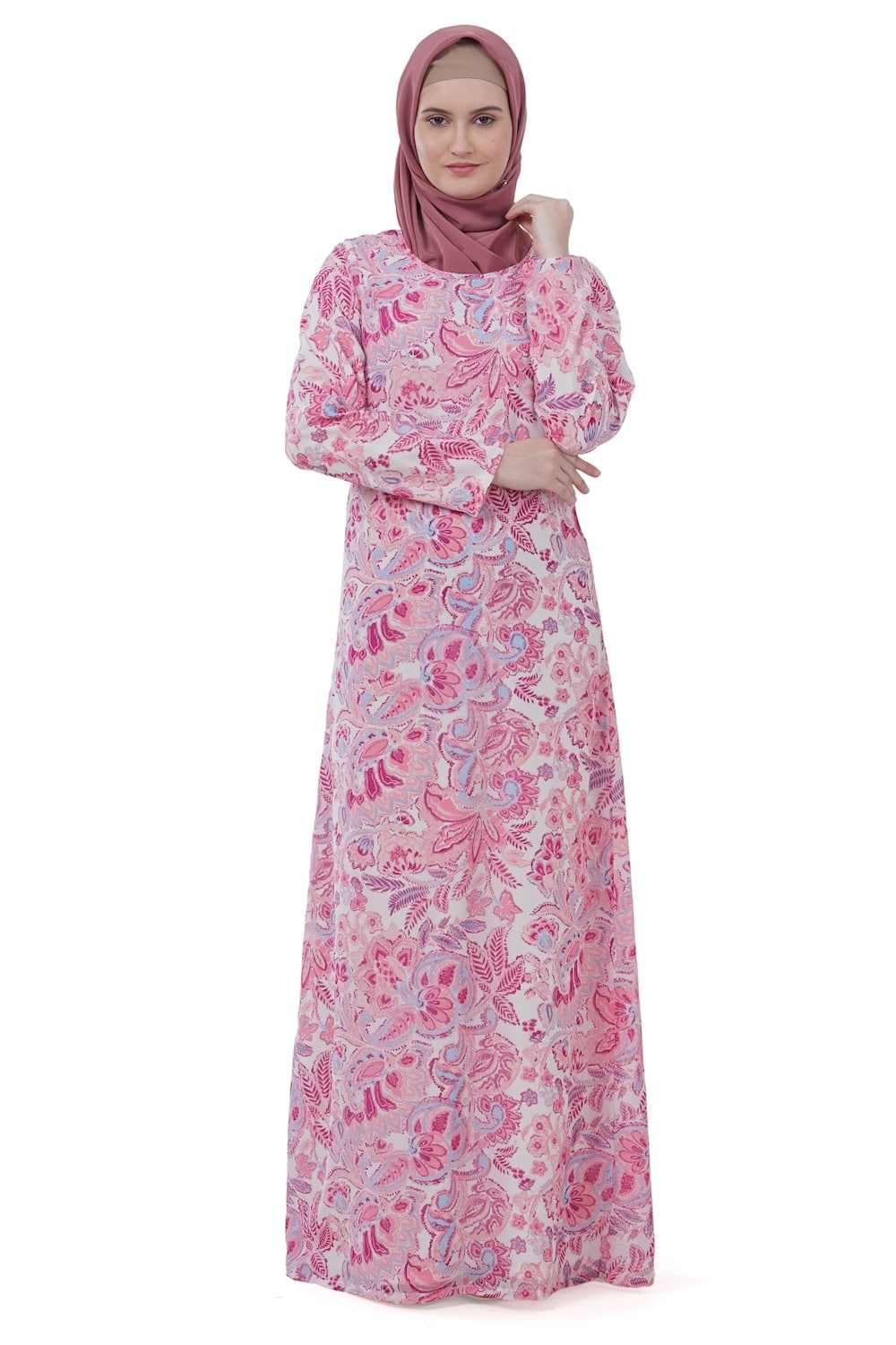Woman wearing a pink floral dress and hijab on a white background