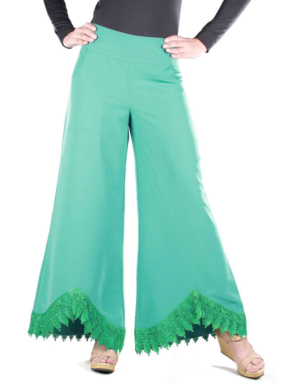 Light green palazzo pants with lace detailing at the bottom and utility polckets on the sides.