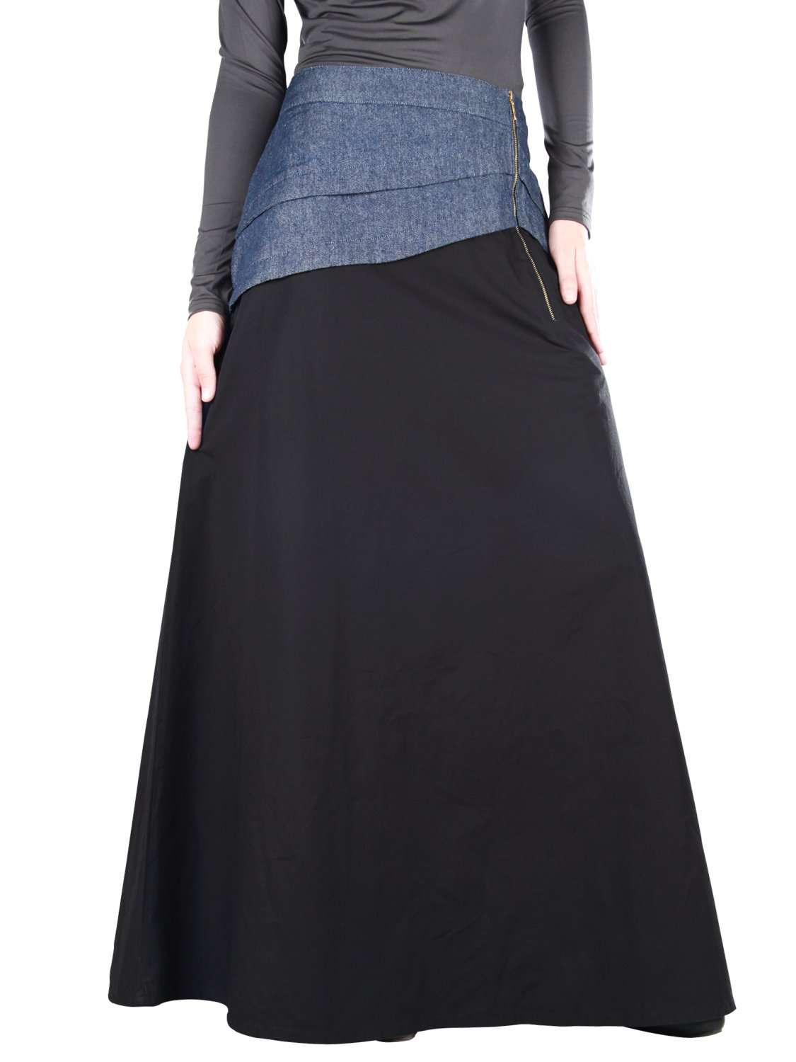 A black cotton denim skirt with a side zipper closure, asymmetric pleated denim patch on top, and utility pockets on the sides.