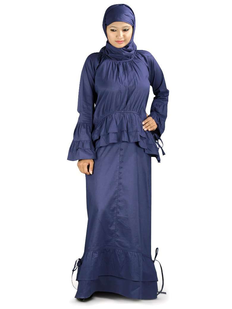 A woman wearing a navy blue abaya with balloon sleeves and frills at the neckline and waist.
