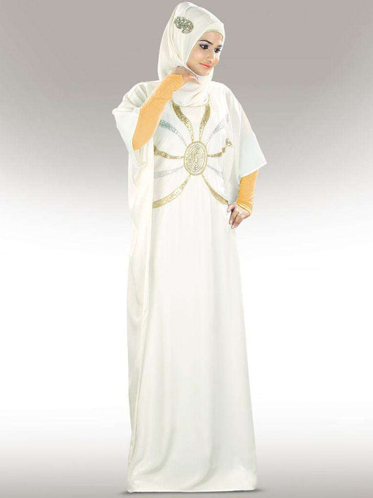 A model wearing an off-white hand embroidered Kaftan with silver and gold details, featuring a round neckline and adjustable belt at the waist.