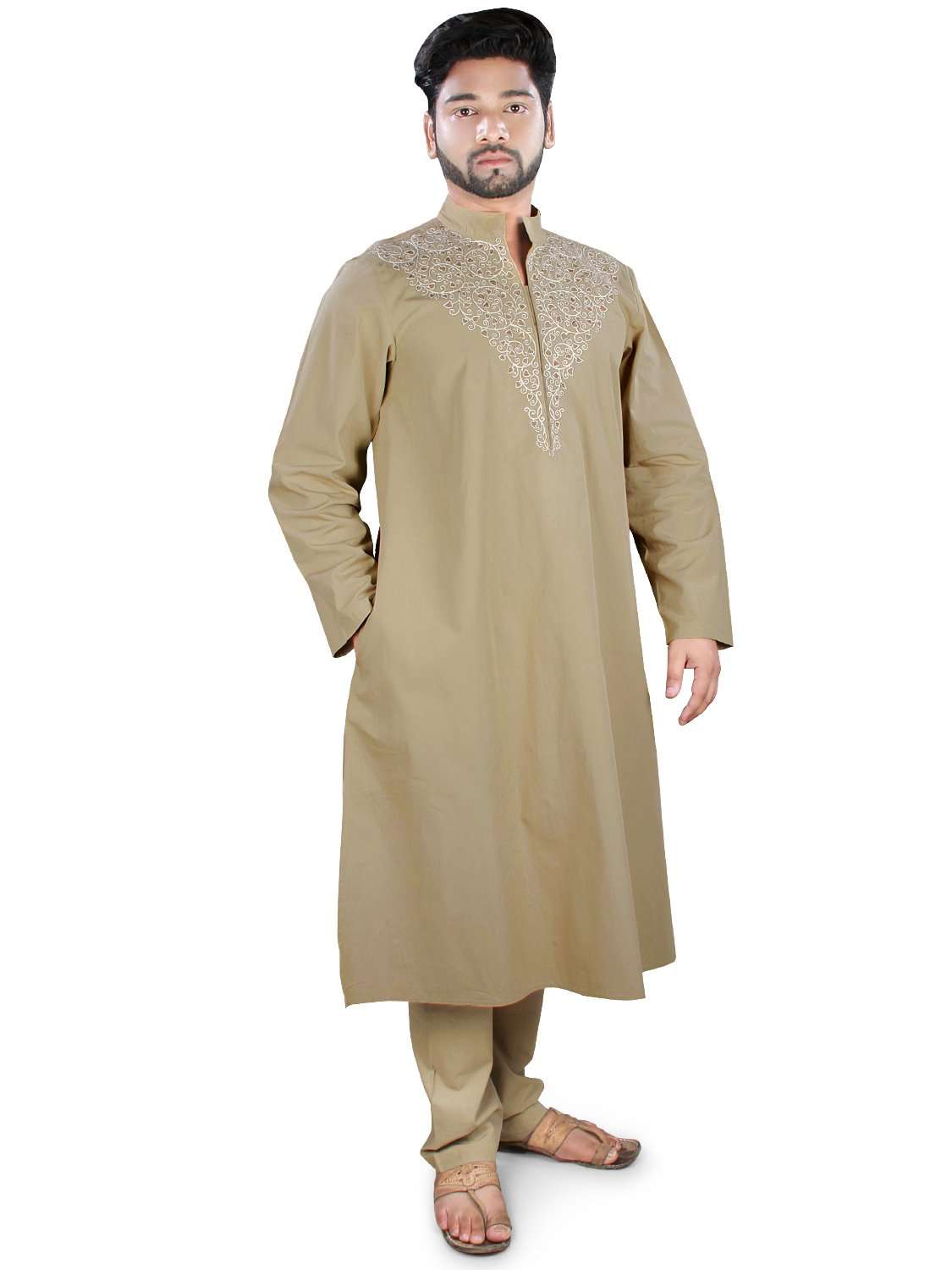 A man wearing a khaki colored kurta pajama set with front open placket and embroidery, and drawstring pants.