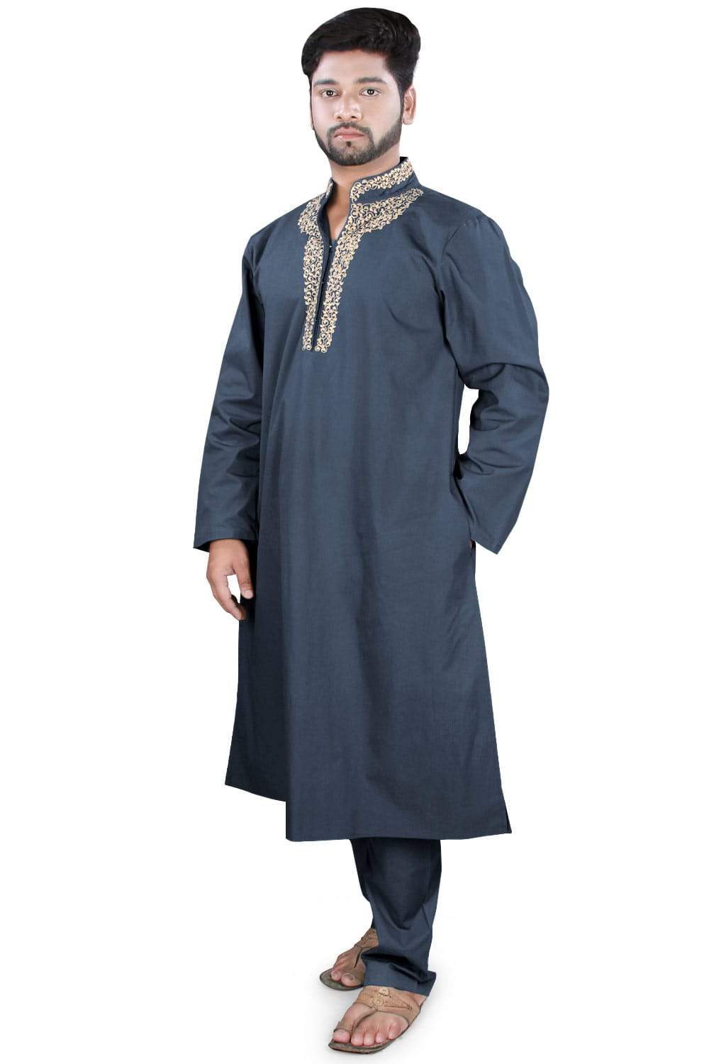 A man wearing a navy blue Kurta Pajama with embroidered details on the collar and front pocket pockets.