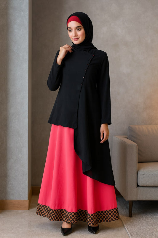 Woman wearing a black top and pink skirt with a hijab in a room.