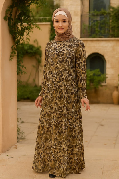 Woman wearing a leopard print dress and hijab in an outdoor setting