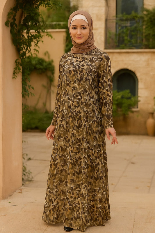 Woman wearing a leopard print dress and hijab in an outdoor setting
